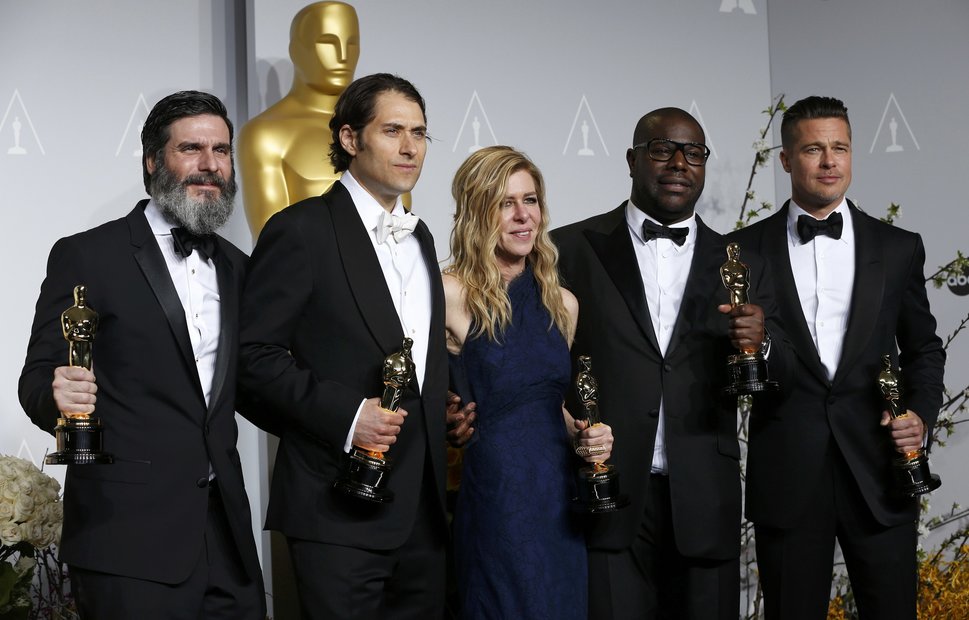 Producers Katagas, Kliner, Gardner, McQueen and Pitt pose with their awards for best picture for "12 Yearts a Slave" backstage at the 86th Academy Awards in Hollywood